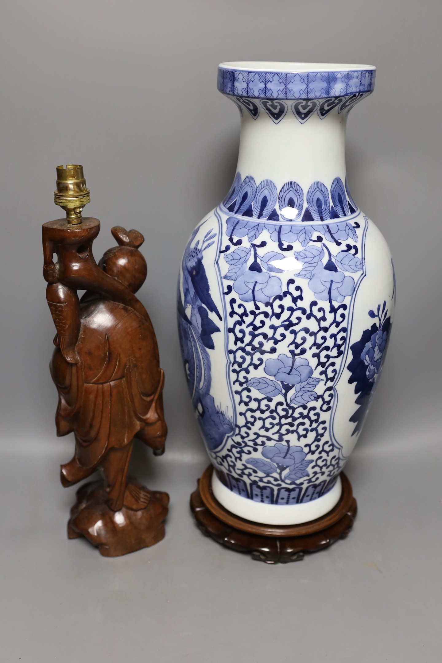 A large Chinese blue and white vase, 50cm tall, and a Chinese fisherman lamp